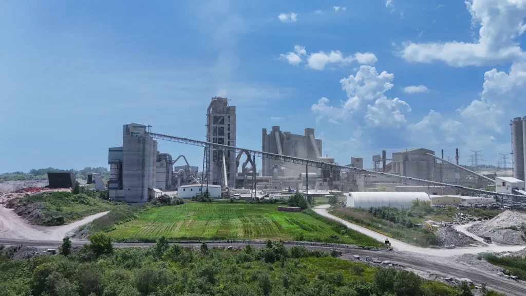 Plant Community Relations - Bowmanville cement plant behind a green field and open lawn