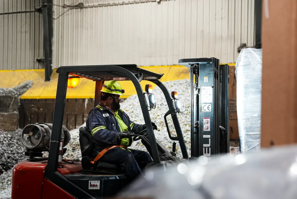 Charlevoix Alternative Fuels - forklift operator moving material in the alternative fuels storage building