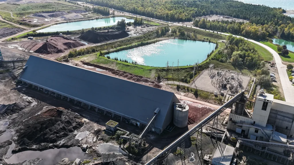 St Marys Cement EPDs - aerial view of a long covered storage building and settling ponds at the Charlevoix plant