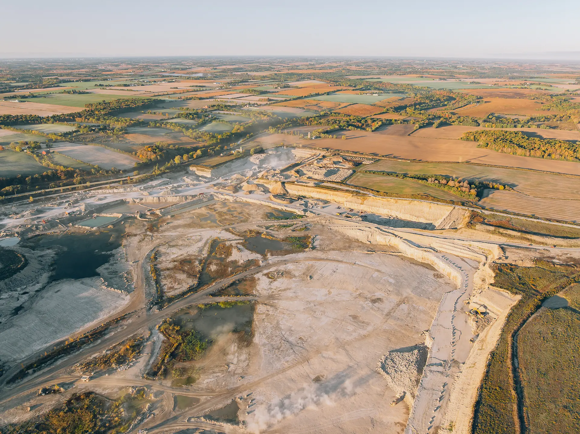 Type I/II Cement - aerial view of the quarry and plant set among farm fields stretching to the horizon