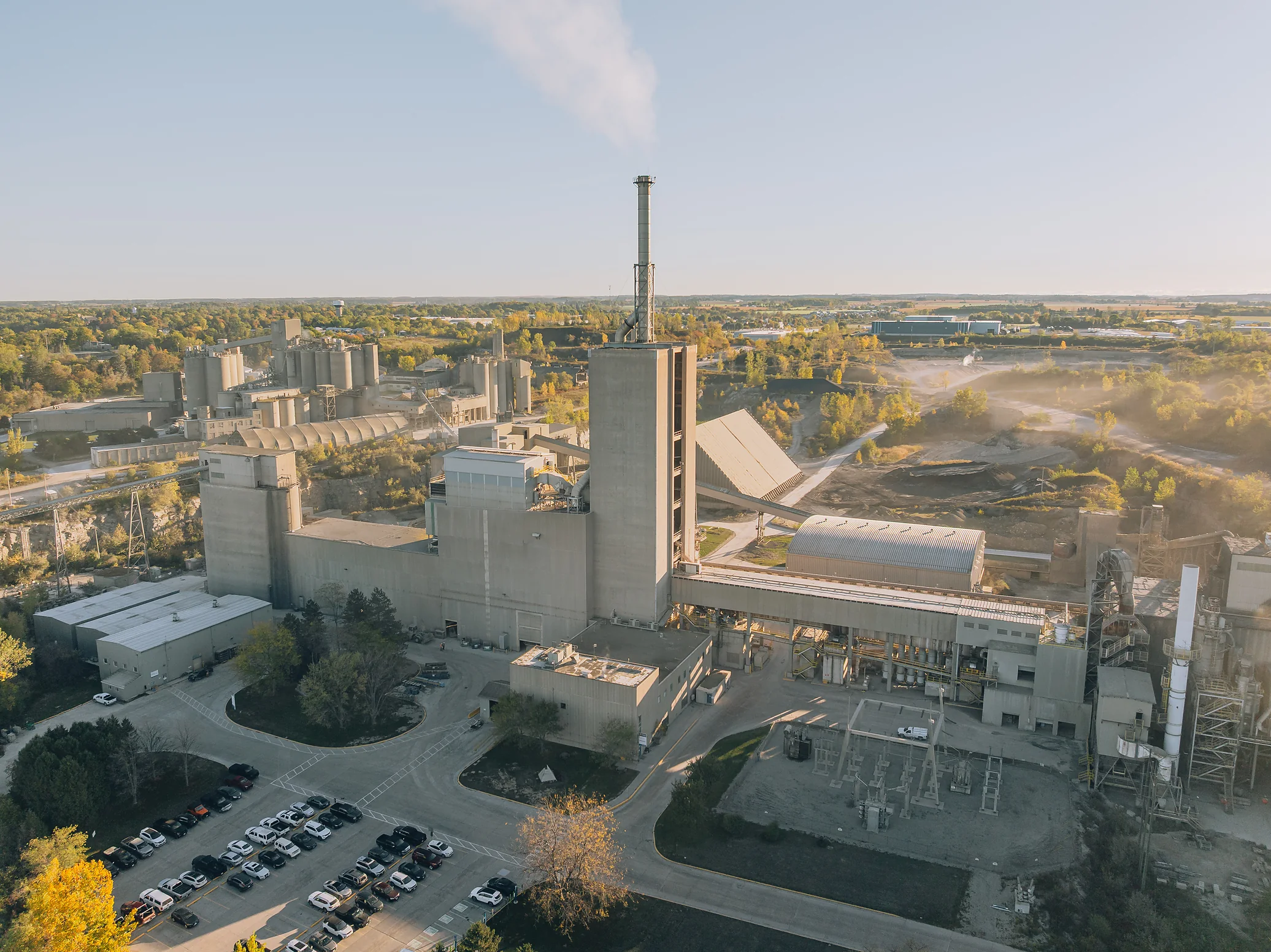 Type S Hi-Bond Mortar Cement - aerial view of the cement plant kiln tower and stack above the staff parking lot