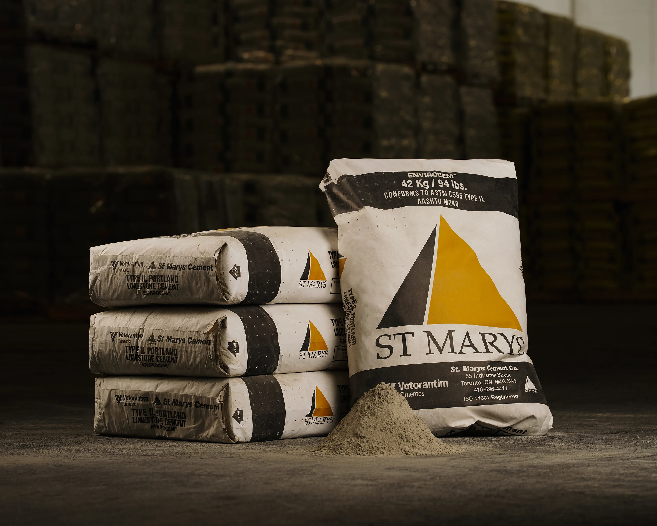 Type GUL Portland Limestone Cement - St Marys Envirocem Type IL bags stacked beside a pile of cement powder