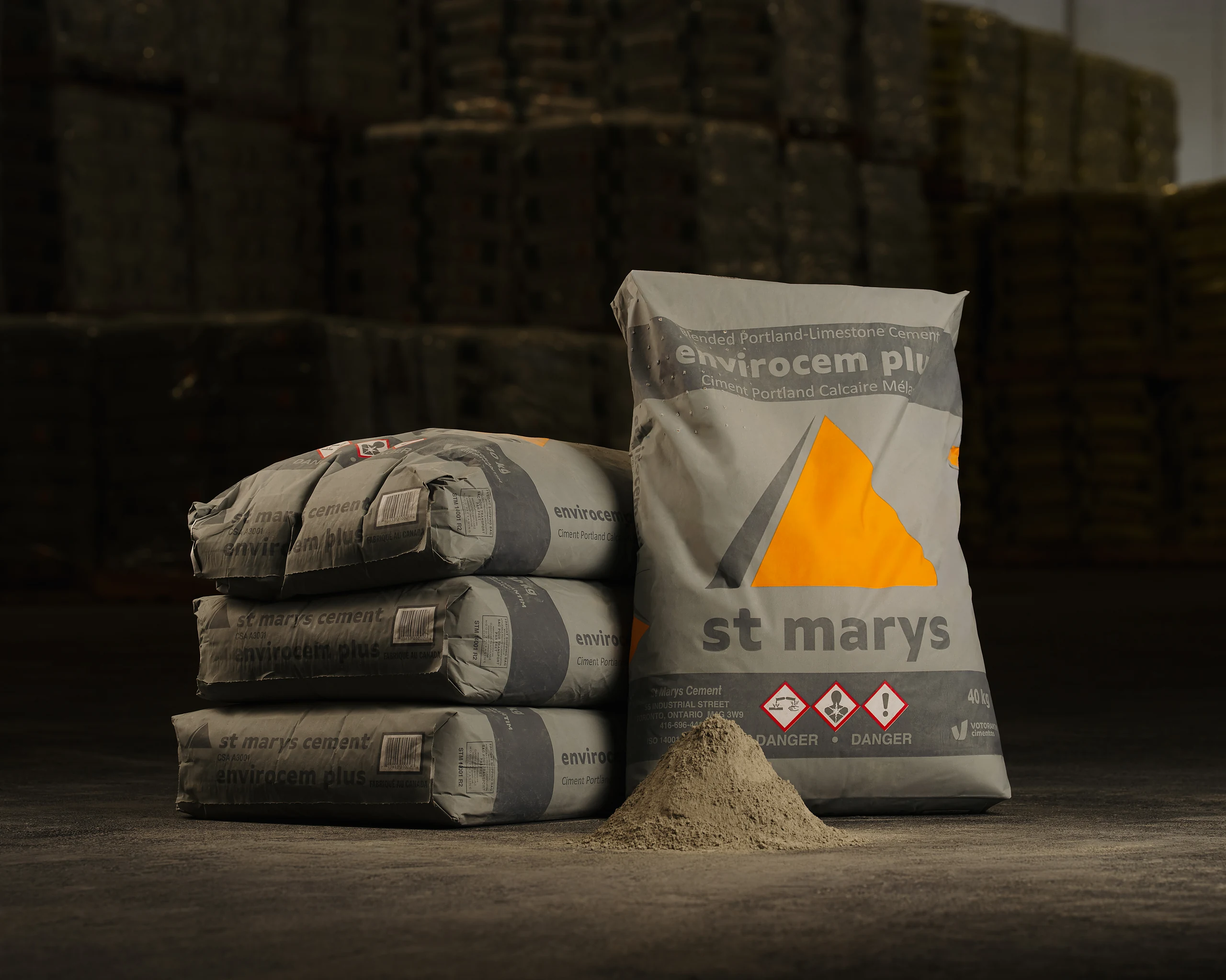 St Marys CemPlus - grey St Marys Envirocem Plus cement bags stacked beside a pile of cement powder