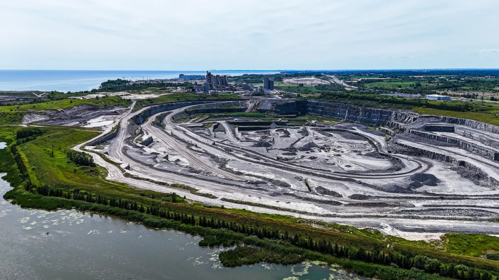 Cement Sustainability Commitments - aerial view of the Bowmanville quarry benches and marsh along Lake Ontario