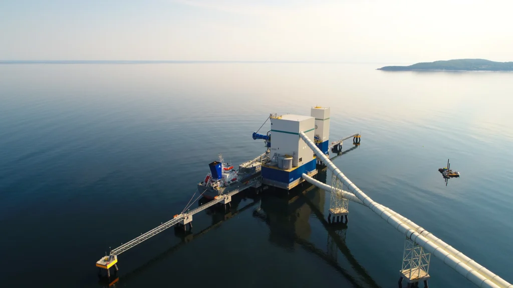 McInnis Cement Plant - aerial view of the McInnis marine terminal and loading dock on calm water